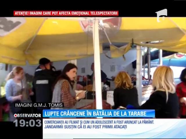 Lupte corp la corp &icirc;ntre comercianți și jandarmi
