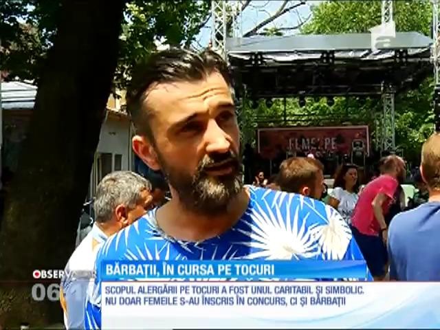 Bărbaţii s-au &icirc;ntrecut &icirc;ntr-o cursă pe tocuri, pe strada Mătăsari din Bucureşti