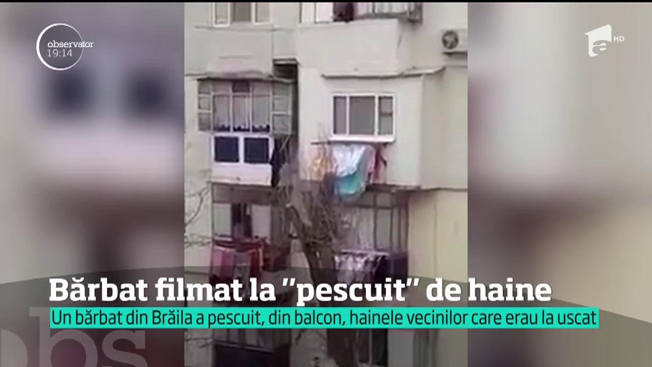 Amuzant şi nu prea! Se întâmplă în România. Bărbat filmat în timp ce pescuiește cu o undiță hainele vecinilor puse la uscat