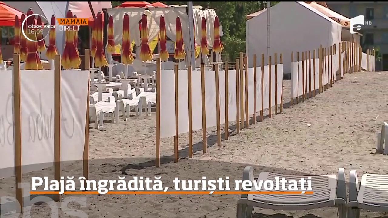 Din dorinţa de a face bani cu orice preţ, administratorul unei plaje din Mamaia a restricţionat accesul turiştilor cu un gard care ajunge p&acirc;nă la mal!
