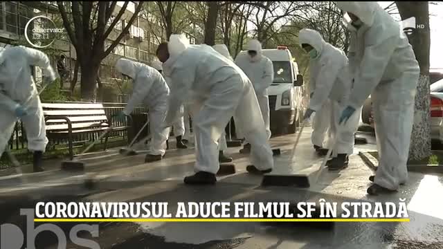 Imagini desprinse din filmele SF &icirc;n Bucureşti. Sute de oameni costumaţi &icirc;n combinezoane albe curăţa fiecare stradă şi bloc &icirc;n parte