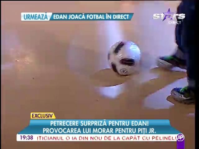 Edan se joaca cu mingea in platou