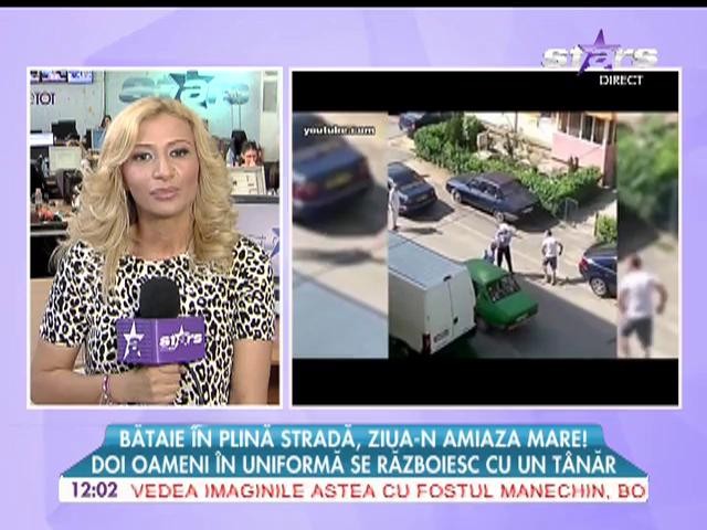 Bătaie &icirc;n plină stradă! Doi oameni &icirc;n uniformă se războiesc cu un t&acirc;năr