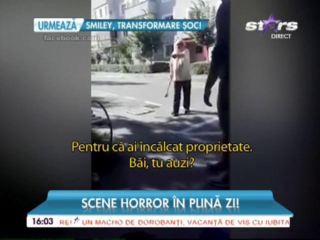 Clipe de groază! Un bunic amenință cu toporul tinerii de pe stradă